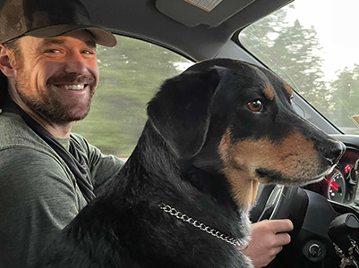 jasper the dog and brent riding in a car